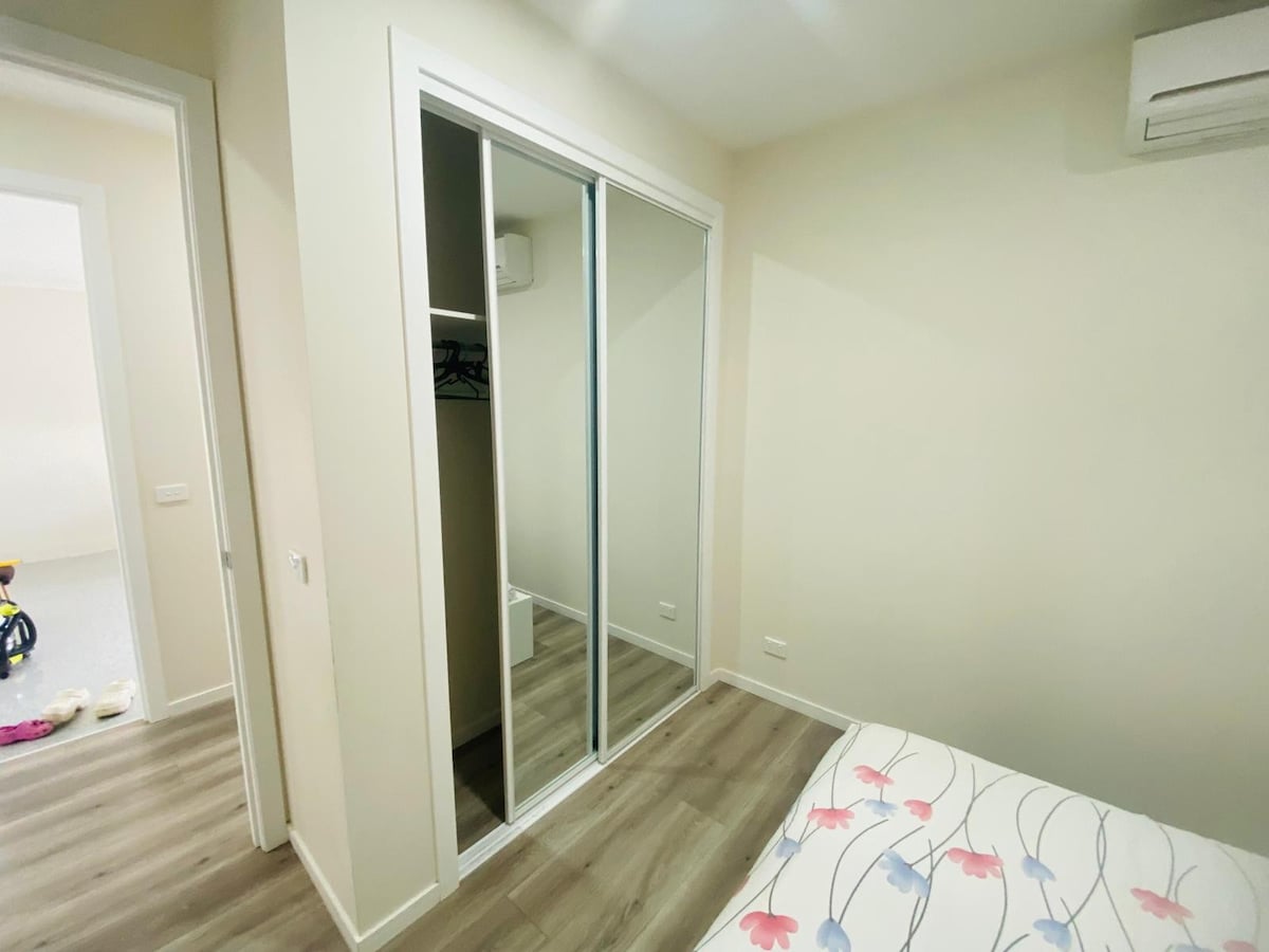 Bedroom with mirrored built-in wardrobe at Luxe Nest, 33 Maya Avenue